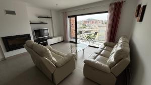 Posezení v ubytování Grand appartement de standing au cœur de la ville