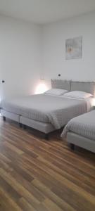 Ένα ή περισσότερα κρεβάτια σε δωμάτιο στο Cristel malpensa room