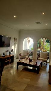 a living room with a couch and a coffee table at villa bahía banus in Marbella