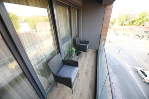 an office with two chairs and a window at Cristal Palace Suites 003 in Kragujevac