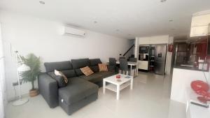 a living room with a couch and a table at Casa el Cielo Spainsunrentals 1184 in El Molino