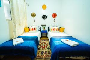 Postel nebo postele na pokoji v ubytování Mabidi Surf Taghazout