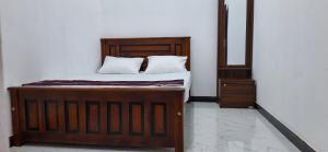 Postel nebo postele na pokoji v ubytování Corniche Villa and Rooms kattankudy + 20 fotografií