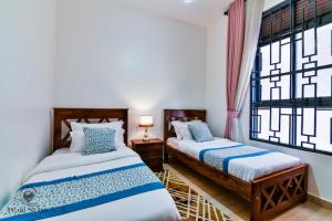 Postel nebo postele na pokoji v ubytování Marina Haven - Cozy 3BR Family Stay by Lake Victoria -Entebbe