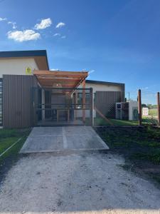 a garage with a wooden roof on a building at Las Olas Miramar in Miramar