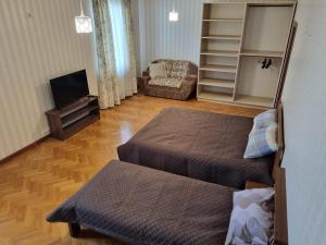 a small room with two beds and a television at Felicità Family Club 