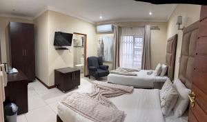 Μια τηλεόραση ή/και κέντρο ψυχαγωγίας στο Aqua Stone guest house