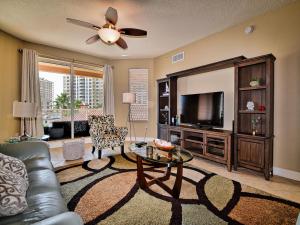 a living room with a couch and a tv at Belle Harbor 401W in Clearwater Beach
