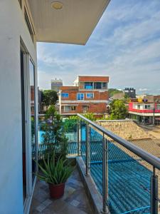 a balcony with a view of a building at Hotel Sueños Libres Necoclí in Necoclí
