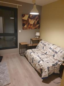 En eller flere senge i et værelse på Confort & Sérénité