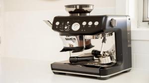 a black coffee machine sitting on a counter at Oceanique in Old Bar