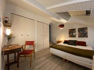 Ένα ή περισσότερα κρεβάτια σε δωμάτιο στο Les Cosy de Nancy - Le repère du roi stanislas 4étoiles