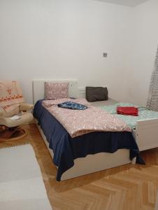 a bedroom with a bed and a chair at B&BAnjanaS in Vaggeryd