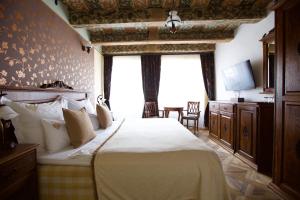 En eller flere senge i et værelse på Hotel Residence U Černého Orla