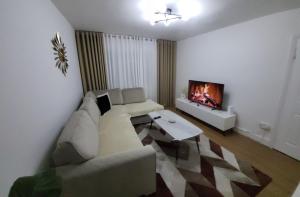 Posezení v ubytování Cosy 1st Floor Flat North London