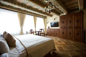 Postel nebo postele na pokoji v ubytování Hotel Residence U Černého Orla