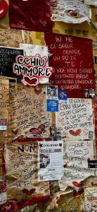 a pile of papers with writing on them at Dea Suite in Naples