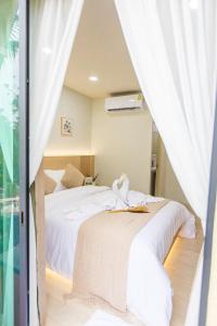 Postel nebo postele na pokoji v ubytování Triple Dreams Resort