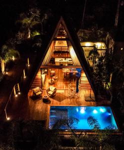 an overhead view of a house with a swimming pool at Zamaya Bangalôs in Sao Jorge
