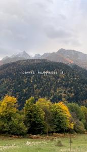 a sign that says close lighthouse on a mountain at Mtis Racha in Oni