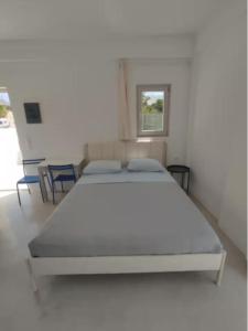 Ένα ή περισσότερα κρεβάτια σε δωμάτιο στο Aurora Galini - Aqua Serenity Stay