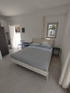 Ένα ή περισσότερα κρεβάτια σε δωμάτιο στο Aurora Galini - Aqua Serenity Stay