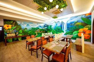 Restaurace v ubytování Heliconia Park Hotel and Golf Resort