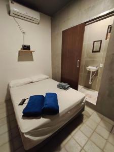 Ένα ή περισσότερα κρεβάτια σε δωμάτιο στο Suíte Natal Luz