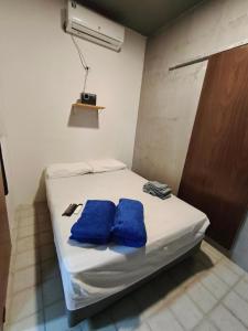 Ένα ή περισσότερα κρεβάτια σε δωμάτιο στο Suíte Natal Luz