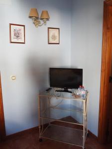 TV a/nebo společenská místnost v ubytování La Ontina Alojamientos Rurales + 36 fotografií