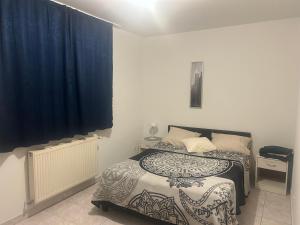 Ένα ή περισσότερα κρεβάτια σε δωμάτιο στο Ady