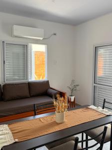 a living room with a couch and a table at RoMa in Reconquista