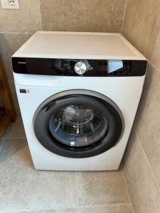 a white washer and dryer in a room at La Villeta di Nonna in Selargius