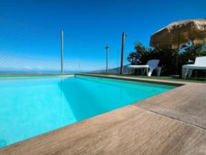a swimming pool with a view of the ocean at La Chavera in Realejo Alto