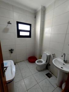 a bathroom with a toilet and a sink at Luxury units for rent on the sea Marsa Matrouh in Marsa Matruh