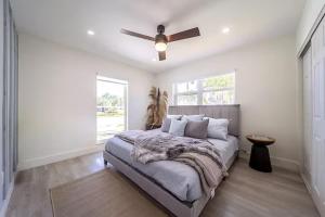 a bedroom with a bed and a ceiling fan at 1134 Hollywood in Hollywood