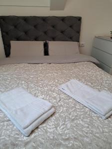 Ένα ή περισσότερα κρεβάτια σε δωμάτιο στο M&M apartman i Spa