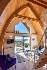an attic conversion of a house with a vaulted ceiling at Perch on the Ridge by Waiheke Pure in Waiheke Island