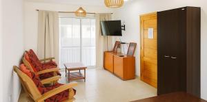 Un televizor și/sau centru de divertisment la J Y C Apart