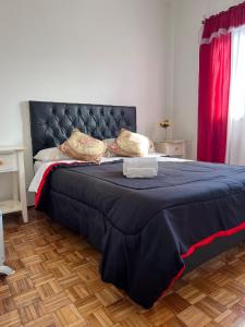 En eller flere senge i et værelse på Nuñez Monumental