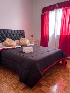 En eller flere senge i et værelse på Nuñez Monumental