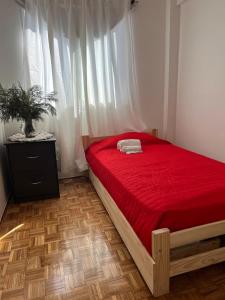 En eller flere senge i et værelse på Nuñez Monumental