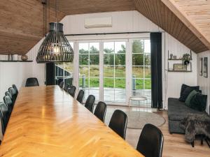 a large dining room with a long table and chairs at Luxury Retreat with Pool - By Traum Ferienwohnungen in Fanø +24 photos