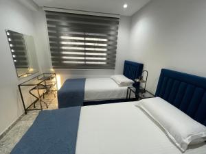 Postel nebo postele na pokoji v ubytování Appartement neuf luxe OLM Aviation à Rabat