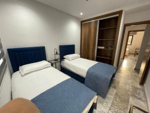 Postel nebo postele na pokoji v ubytování Appartement neuf luxe OLM Aviation à Rabat + 4 fotografie