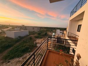 a view from the balcony of a house at sunset at TWO M RÉSIDENCE M&M Thies ZAC Nguinth in Thiès