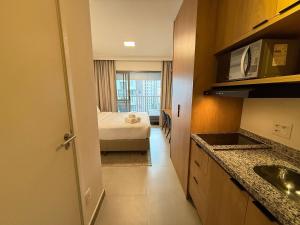 a small room with a bed and a kitchen at On Jurupis in Sao Paulo +291 photos