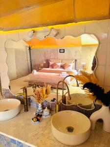 a bathroom counter with a sink and a bed at iMei Lux Camp 爱梅野奢营地 in Lac Yasmins +94 photos