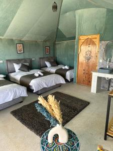 a room with three beds in a tent at iMei Lux Camp 爱梅野奢营地 in Lac Yasmins