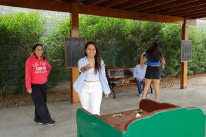 a group of women standing around a table at Casa Andina Standard Chincha in Chincha Alta +109 photos